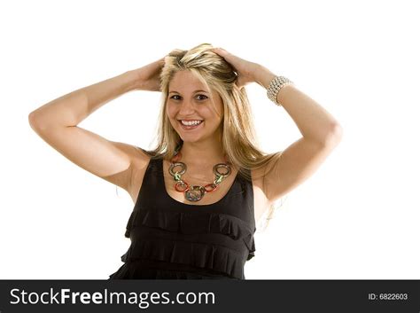 blonde in black dress pulling hair back free stock images and photos 6822603