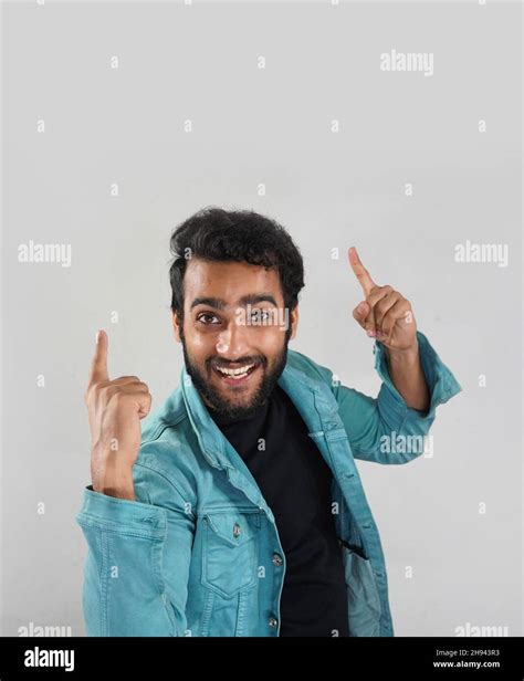 Image Of A Man Who Is Showing Something On Top By His Hand Stock Photo
