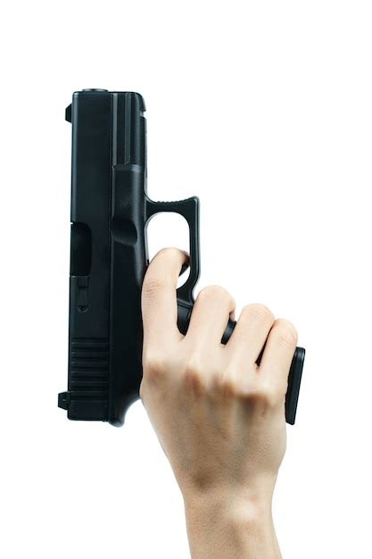 Premium Photo Hand Holding Gun