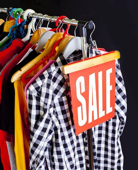 Sale In A Clothing Store Discount Sign At A Clothes Rack Stock Image