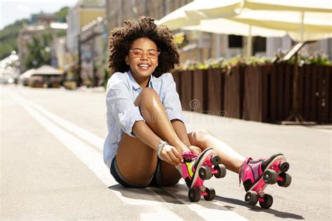 Teen Girl Putting On Roller Skates Stock Image Image Of