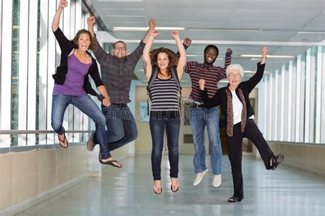 Excited Multiethnic University Students Jumping Stock Image Image Of