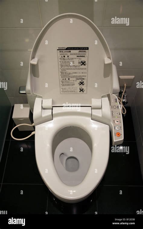 Japanese Washlet Or Super Toilet Which Includes Seat Warming Bidet