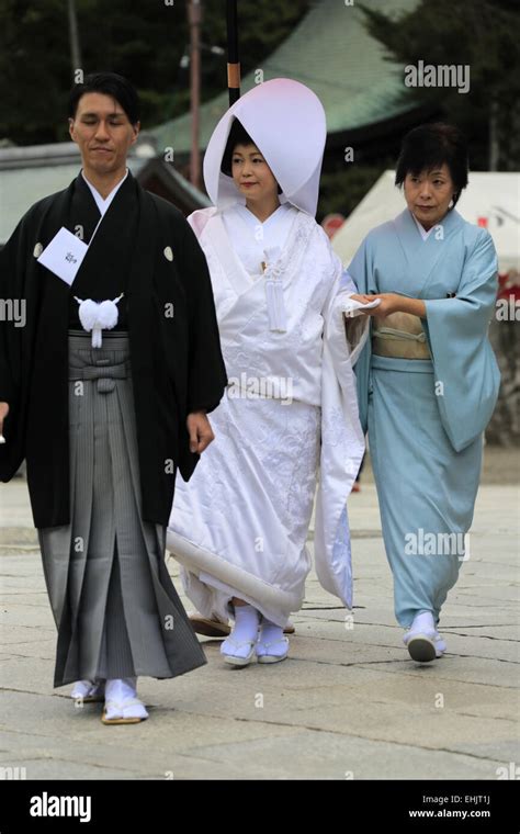 A Japanese Bride And Groom In Traditional Wedding Kimono During A