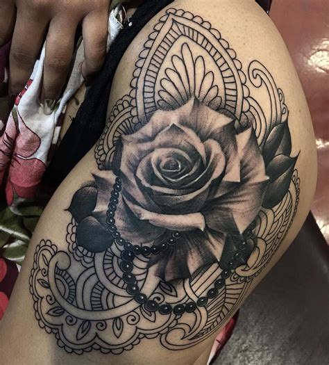 Devil wings heart and red rose tattoo on left hand. Black and Grey Tattoos by Tattoo Artist Oscar Morales