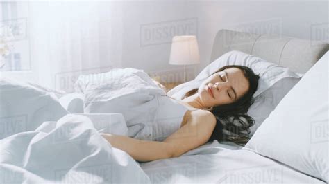 Attractive Brunette Cozily Sleeps In Her Bed While Early Morning