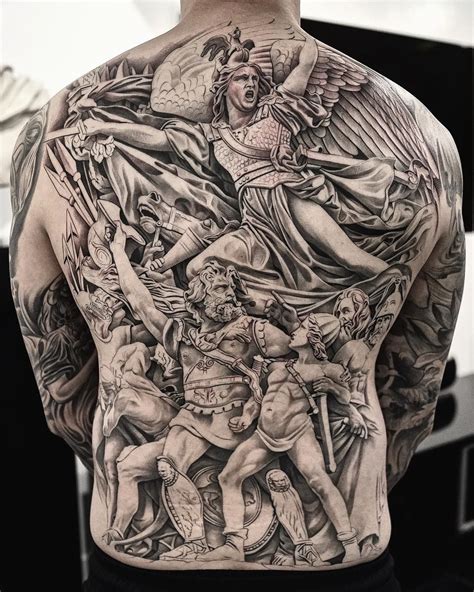 The Back Of A Mans Body With Many Different Tattoos On His Chest And Shoulder