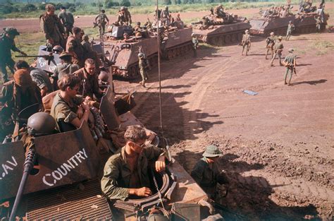 11th armored cavalry armored personnel carriers and tanks sweep into rubber plantation area at