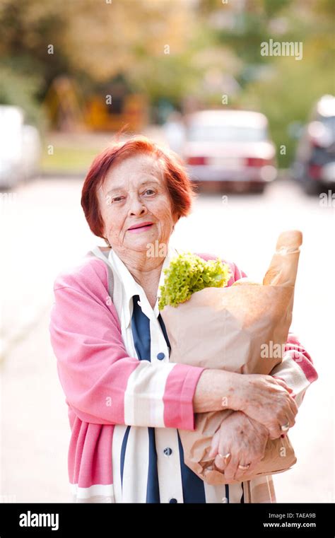 Laughing Senior Woman 70 80 Year Old Holding Paper Bag With Food
