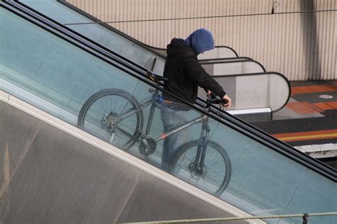Taking A Bike Down The Escalators At North Melbourne Station Wongms