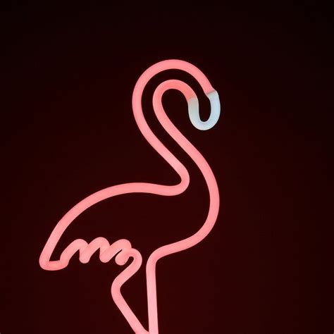 A Neon Sign That Has A Pink Flamingo On It