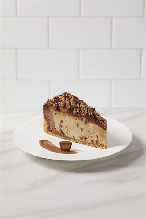 It has an oreo crust, a nutella and cream cheese filling, and a topping of freshly whipped cream. Reese's Peanut Butter Chocolate Cheesecake - Coveted Cakes