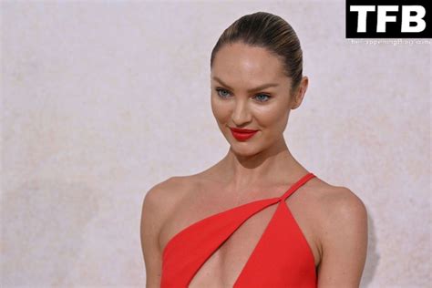 Candice Swanepoel Poses Braless In A Red Dress At The Amfar Gala Cannes