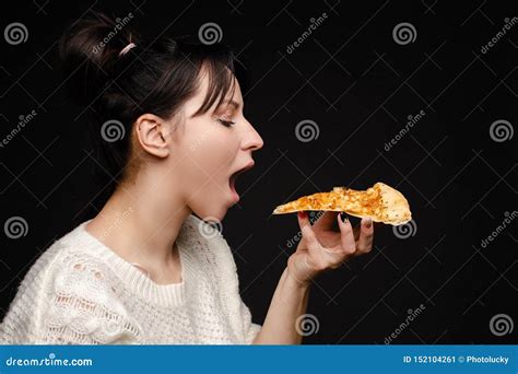 A Piece Of Pizza Is On A White Paper Plate Yellow Background Stock