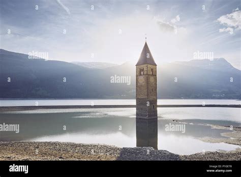 Old Church Tower In Water At Sunset Resia Lake Lago Di Resia Or