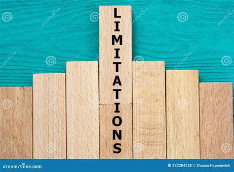 Limitations Word On Wooden Bars On A Green Background Stock Photo