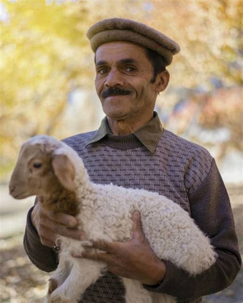Portrait Of A Hunza Man Holding A Lamb Captured By Wasif Mehmood