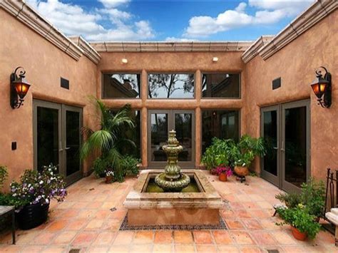 A spanish style home with a courtyard made for celebrating. Pin by Dale Swanson on Hacienda Style | Hacienda style ...