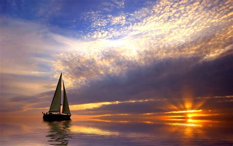 Sailing Boat In The Calm Sea At Sunset Wallpapers And Images Wallpapers Pictures Photos