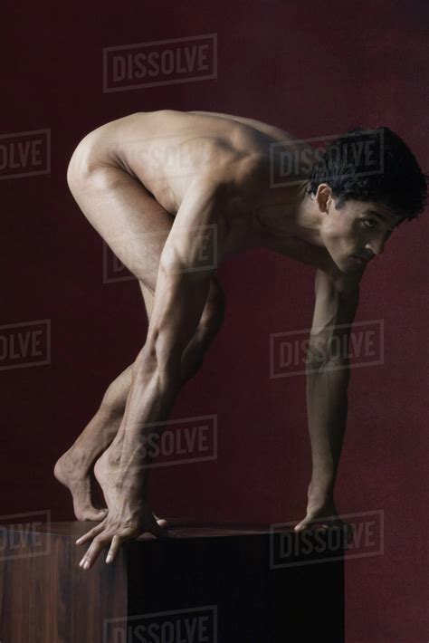 Nude Man Crouching In Starting Position Full Length Stock Photo