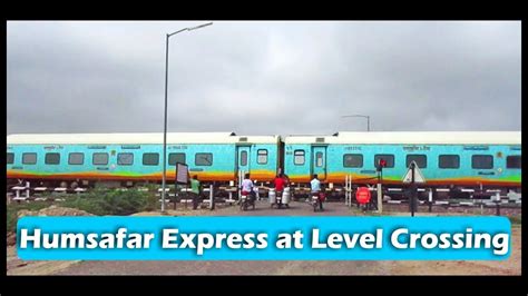 tpj sgnr humsafar express at level crossing indian railways youtube