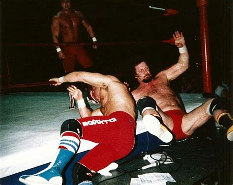 Dynamite Kid And Terry Funk Battle Outside The Ring As Davey Boy Smith