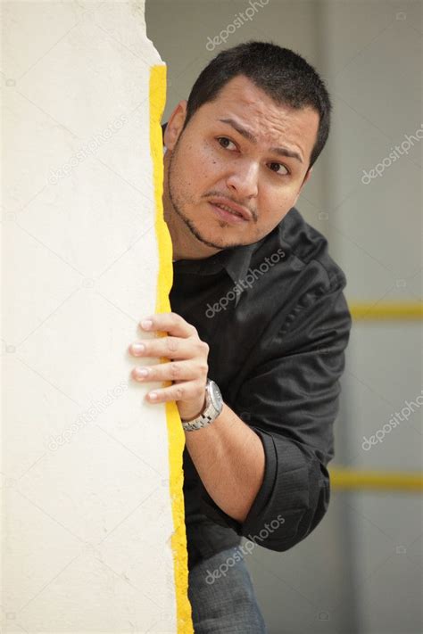 Man Hiding Behind A Wall — Stock Photo © Felixtm 6036421