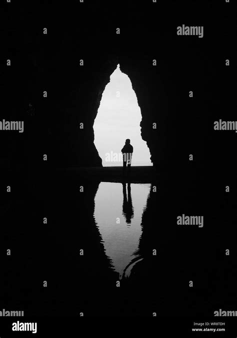 Silhouette On Boat In Cave Entrance Stock Photo Alamy