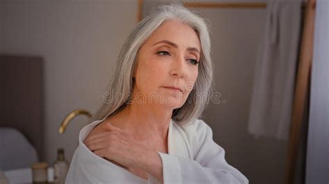 caucasian granny grandmother old model female elderly 60s caucasian lady woman in bathrobe in