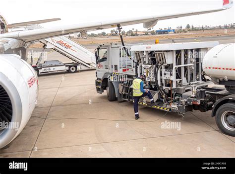 A Worker Employee Refueling Iberia Airlines Airbus A320 Twin Engine Jet