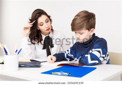 Young Teacher Trying Explain Information Boy Stock Photo 1356241139
