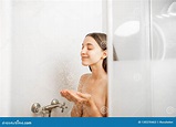 Woman taking a shower stock image. Image of bathing - 130370463