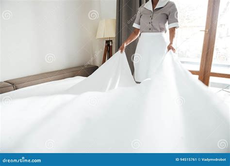 Cropped Image Of A Hotel Maid Changing Bed Sheet Stock Image Image Of