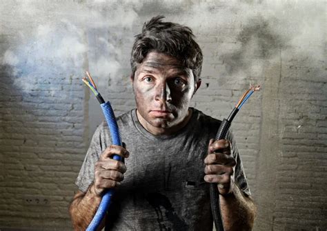 Untrained Man Joining Electrical Cable Suffering Electrical Accident With Dirty Burnt Face In