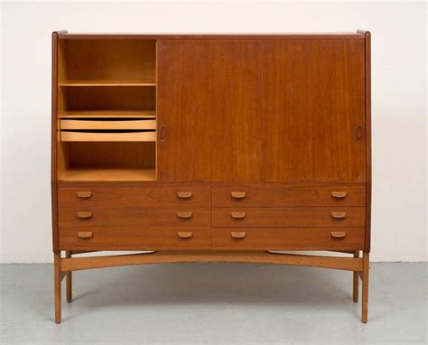 The old teak gives a luxurious look and has character because it has experienced different life cycles. Poul Volther Tall Teak Cabinet For Sale at 1stDibs