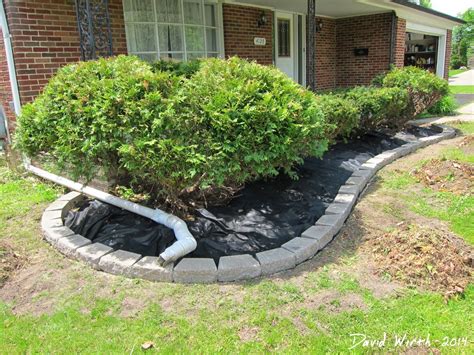 This time on using cinder blocks to build steps. Easy Landscape Block Wall and Mulch