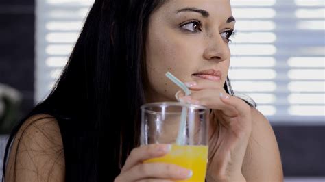 Beautiful Brunette Woman Drinking Orange Stock Footage SBV 300601706