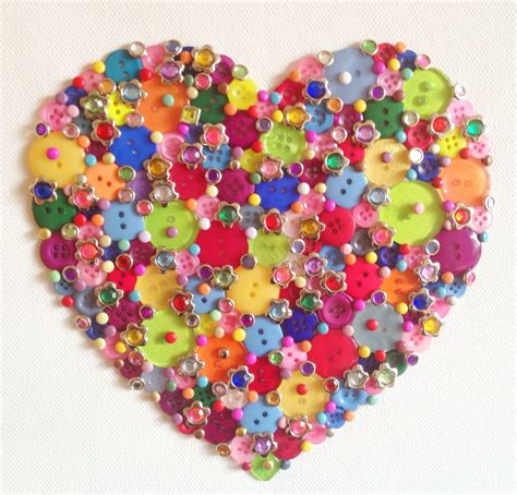 A Heart Made Out Of Buttons On A White Background