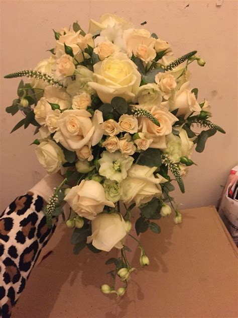 Maybe you would like to learn more about one of these? Waterfall wedding bouquet using roses, delphinium ...
