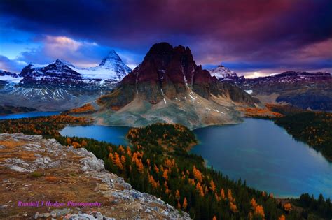 Sunset On A Cloudy Day With Mt Assiniboine Over Cerluean Lake An