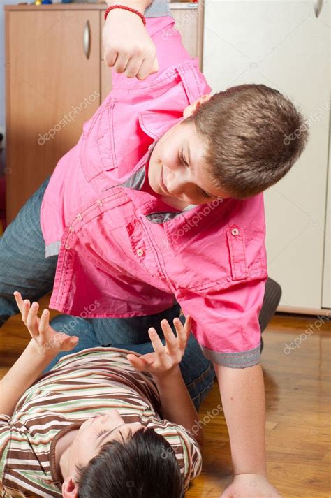 Two Teenage Boys Fighting In The Room — Stock Photo © Solidphotos 9012547