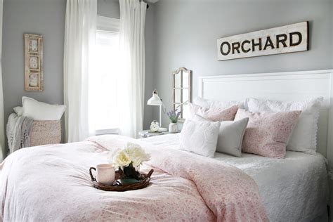 It includes two nightstands and one bed, all made from a blend of solid and engineered wood in a neutral hue. Sweet and Simple Guest Bedroom Decor | Abby Lawson