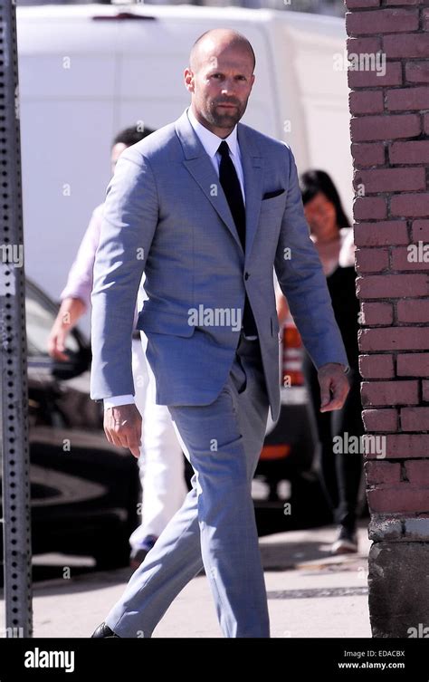 Actor Jason Statham Puts On A Gray Suit At A Photoshoot In Downtown La