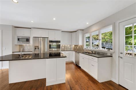 Stainless steel appliances framed by white shaker cabinets. Pin on Home