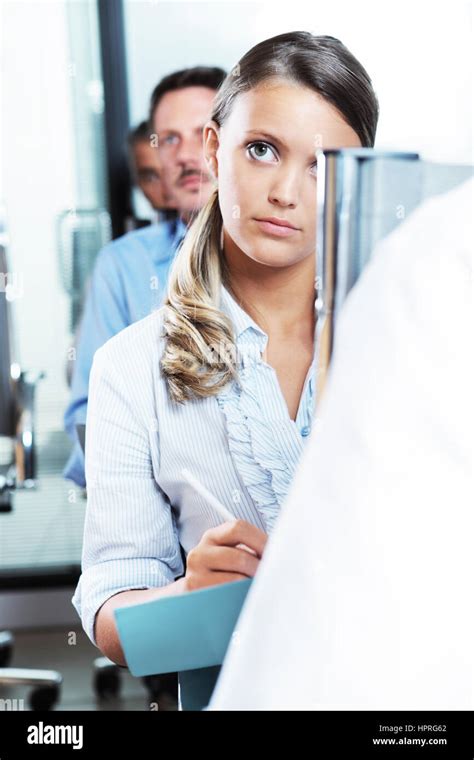 Business Colleagues Taking Notes During A Seminar Stock Photo Alamy