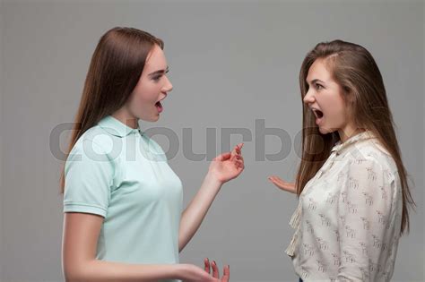 Two Babe Women Screams At Each Other Stock Image Colourbox