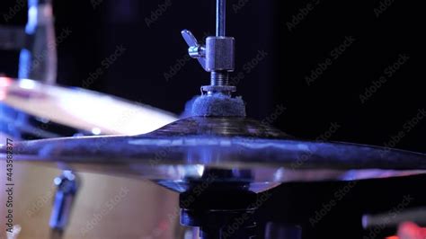 Musician Plays Drums On Dark Stage Under Bright Spotlights Hi Hat