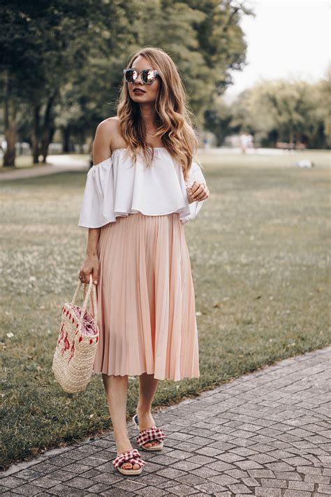 picnic outfit the three must haves a midi skirt a straw bag and a pair of cute slippers