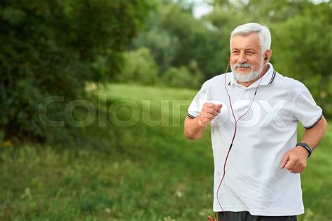 Smiling Running Old Man In Green City Park Stock Image Colourbox