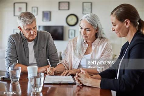 Mature Couple Signing Photos And Premium High Res Pictures Getty Images